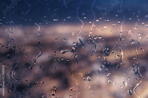 Rainy glass and blurred city landscape © Jiva Core