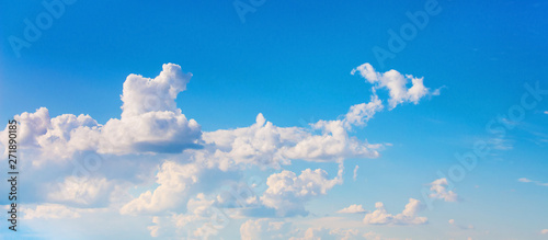 Wonderful white clouds on blue sky in sunny weather_