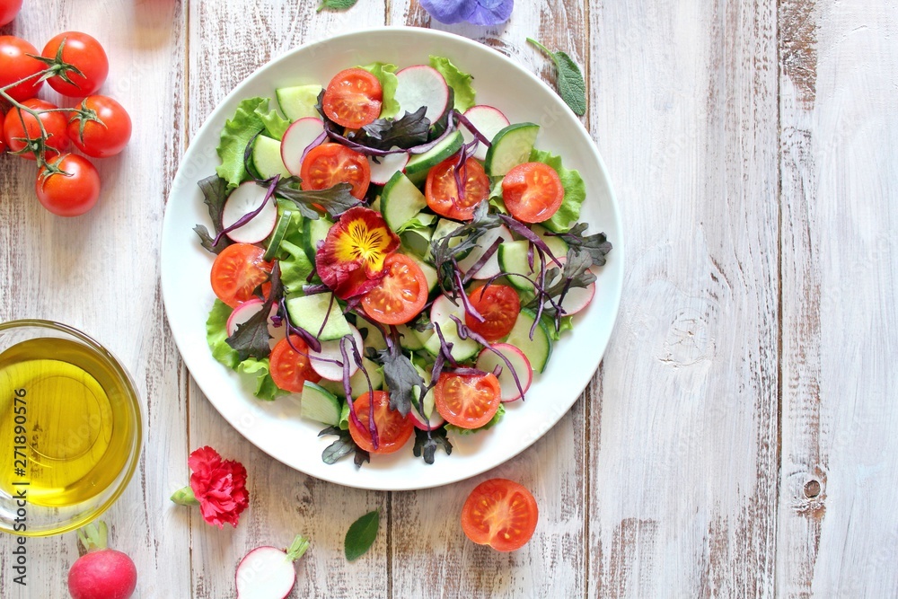 Fresh vegetables salad: tomato, lettuce, cucumber and raw on light background. Top view with copy space. Fresh vegetables salad: tomato, lettuce, cucumber and raw on light background. Top view with copy space.