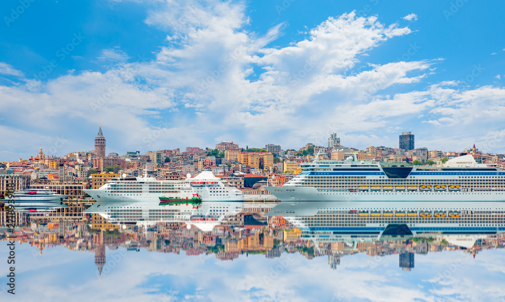 Luxury cruise ship in Bosporus against galata tower - Istanbul, Turkey