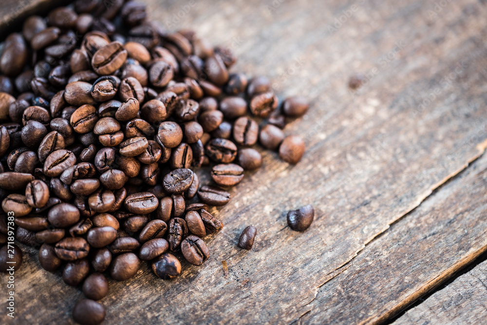 Coffee cup and coffee beans on wooden background. Top view Coffee cup and coffee beans on wooden background. Top view