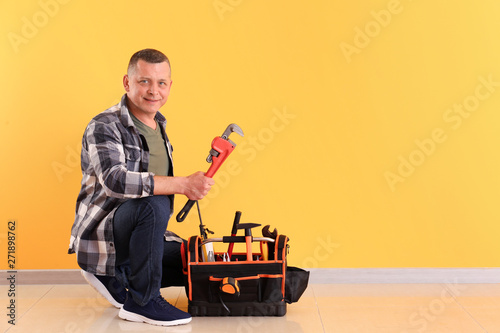 Handsome plumber with tools...