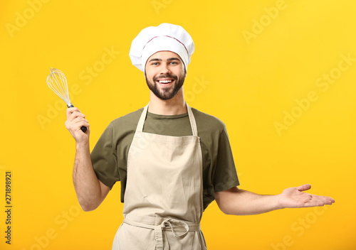Handsome male chef on color...