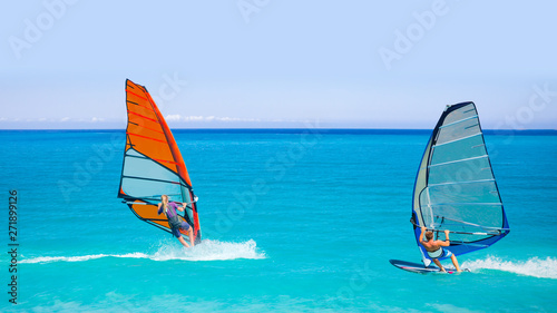 Beautiful cloudy sky with Windsurfer Surfing The Wind On Waves In Alacati - Cesme, Turkey © muratart