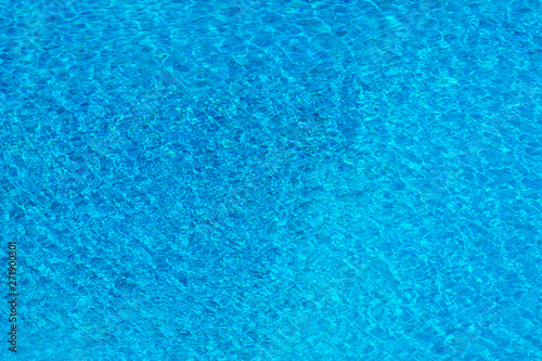 Rippled water for background. Water surface in swimming pool.
