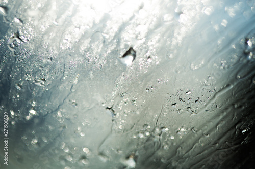 Rain drop at surface of a car. Water drop background. 