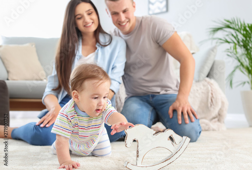 Happy parents with cute lit...