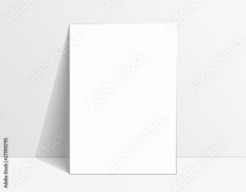 White poster mockup standing on the floor near white wall. Blank Canvas Mockup for design © skvalval