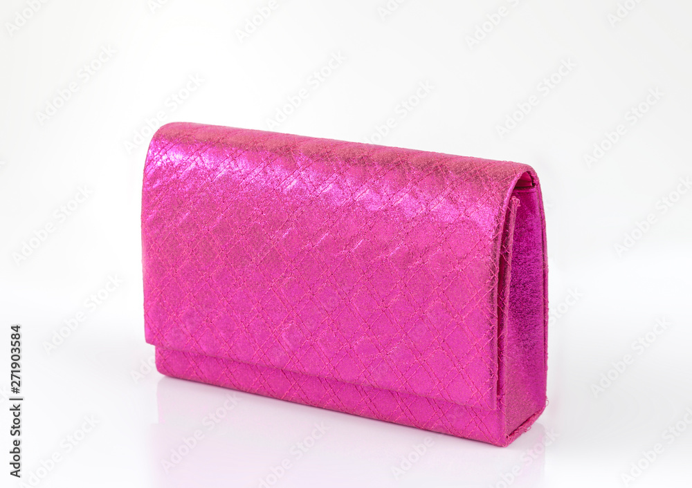 Obraz premium Magenta pink clutch isolated on white background
