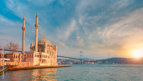 Ortakoy mosque and Bosphorus bridge at amazing sunset - Istanbul, Turkey