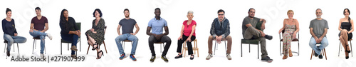 group of mixed people sitting on white
