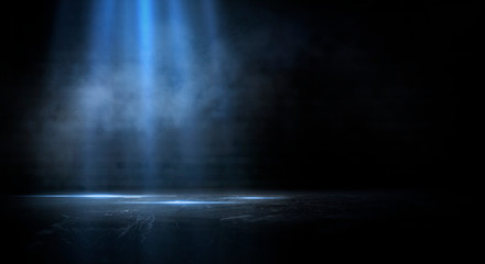 Dark empty scene, blue neon searchlight light, wet asphalt, smoke, night view, rays. Empty black studio room. Dark background. Abstract dark empty studio room texture.  Product showcase spotlight back