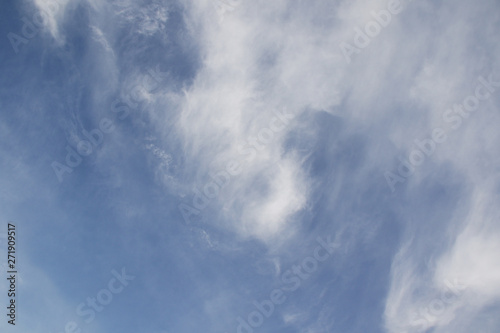 white fluffy clouds and blue sky background © Iveta
