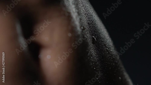 drop of sweat or water runs down the athlete's body fatigue after training macro skin shooting