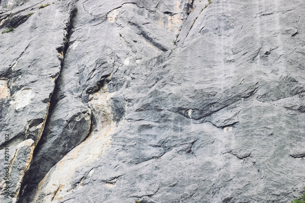 Rock texture background with cracks. Natural background. Closeup of stone, horizontal image.
