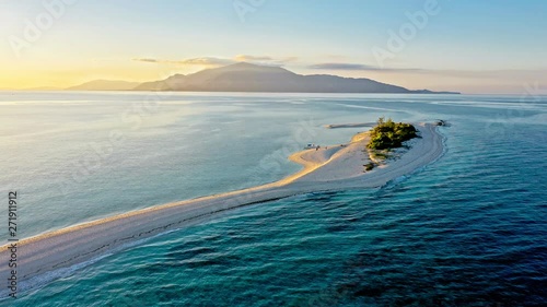 Epic aerial view of tropical island at sunset