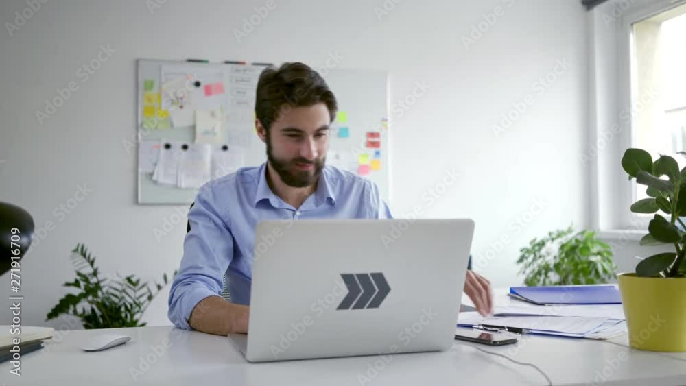 Startup businessman working with laptop and documents in office Startup businessman working with laptop and documents in office