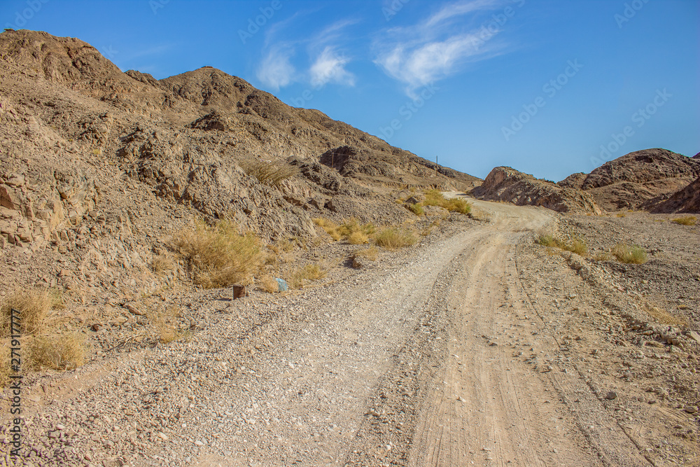 wasteland dry mountain scenery landscape and lonely trails through wilderness empty environment wasteland dry mountain scenery landscape and lonely trails through wilderness empty environment
