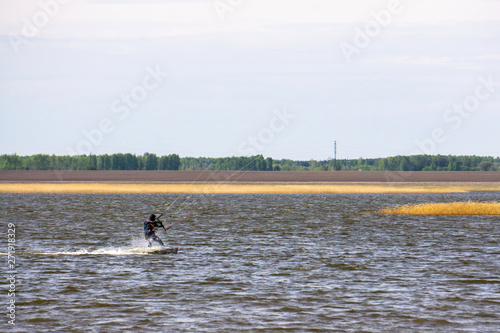 Photography kite surfing on the lake's beach