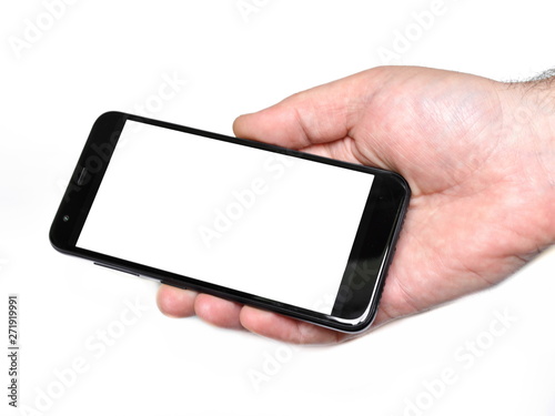 Black classic modern smartphone with white clean empty space on screen for writing your text in male palm on white background. Isolated. Mock up