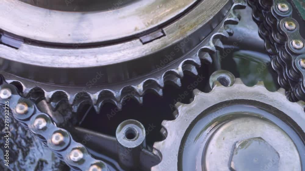 Proper operation of oiled gears and rollers. Shine oil. Abstract idea of interaction. The movement of mechanical gears in industrial equipment. Proper operation of oiled gears and rollers. Shine oil. Abstract idea of interaction. The movement of mechanical gears in industrial equipment.