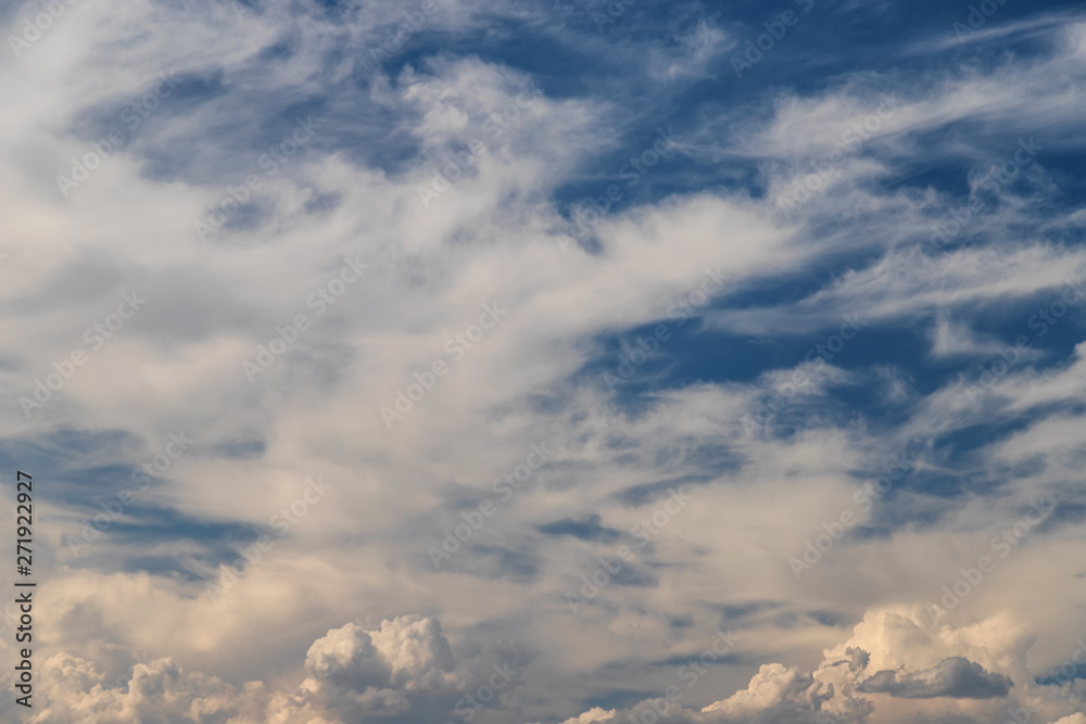 Unusual shape small fluffy clouds in the blue sky Unusual shape small fluffy clouds in the blue sky