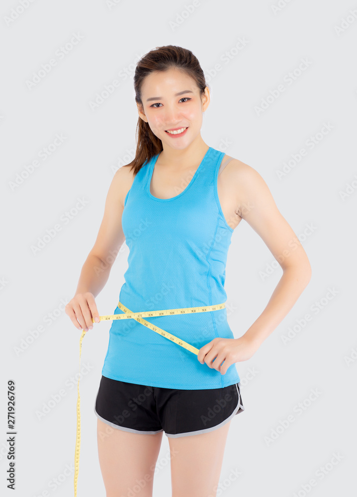 Beautiful slim young asian woman measuring tape thin waist wear uniform fitness isolated white background, asia girl loss weight for diet with exercise and workout wellbeing and healthy care body. Beautiful slim young asian woman measuring tape thin waist wear uniform fitness isolated white background, asia girl loss weight for diet with exercise and workout wellbeing and healthy care body.