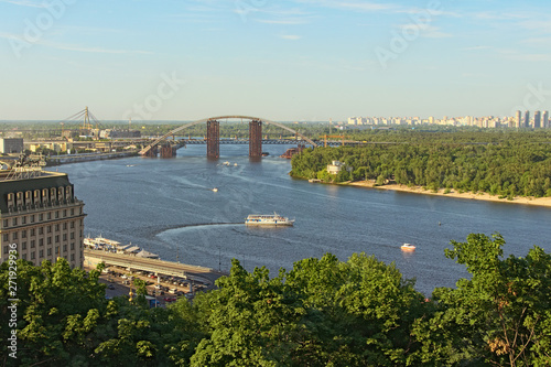 Kyiv, Ukraine-June 01, 2019:Aerial landscape view of Kyiv at summer sunny day. Beautiful Dnipro River with bridges and Obolon district at the background. Famous touristic place and travel destination