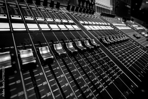 Closeup view of Faders on Professional Audio Digital Sound Mixing Control Console.