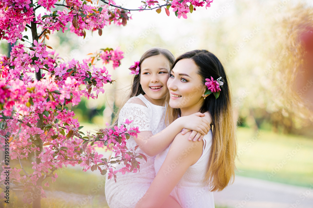 Fototapeta premium Closeup portrait of gentle gentle motherhood parenting feel satisfied am glad to have free time warm and cozy to cuddle the touch of a hand to show confidence to wear stylish white clothes in spring 