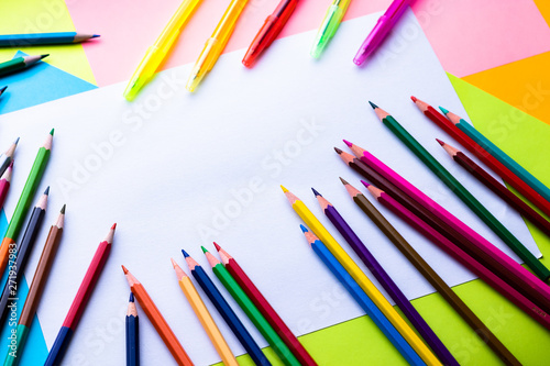 color pencils and pens isolated on white background