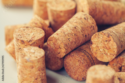 Heap of assorted wine corks on wooden background