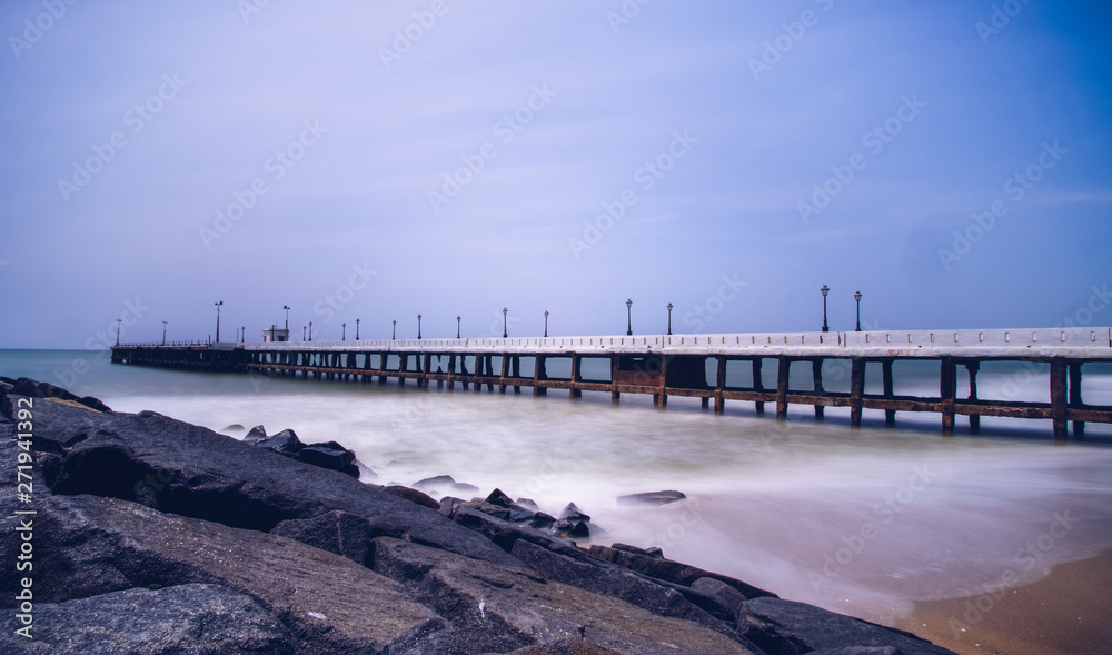 Old pier at Promenade Beach. Rock Beach is the popular stretch of beachfront in the city of Puducherry, India, along the Bay of Bengal