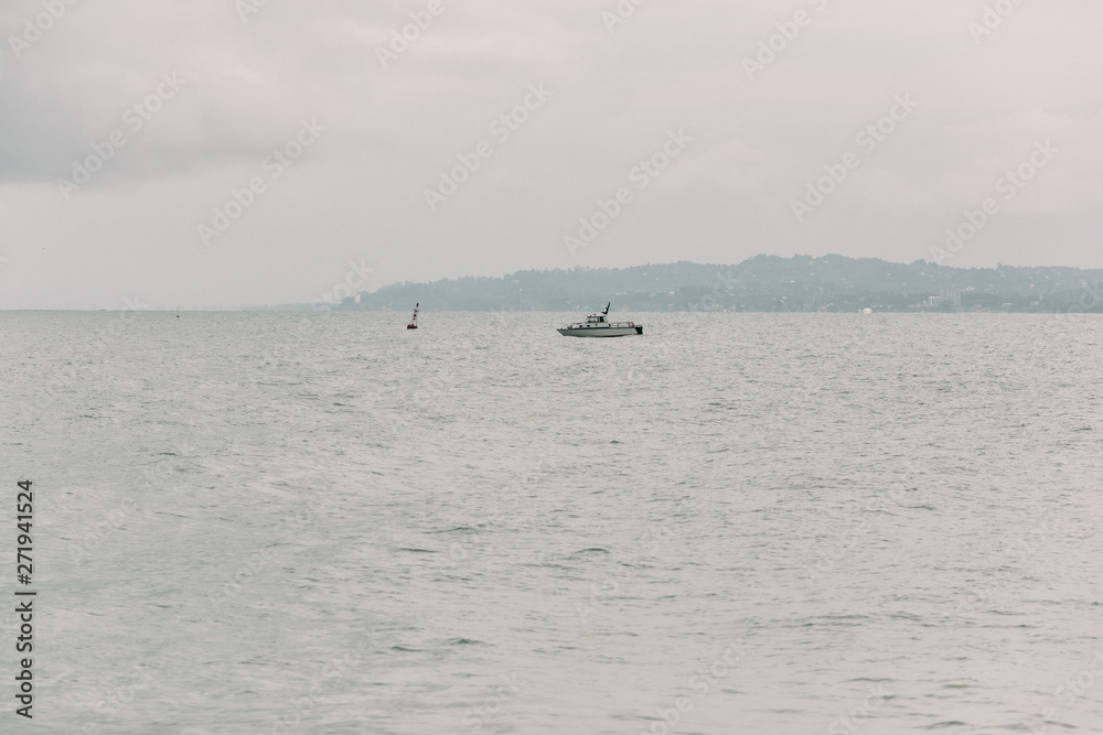 Obraz premium yacht in the Black Sea on a cloudy day