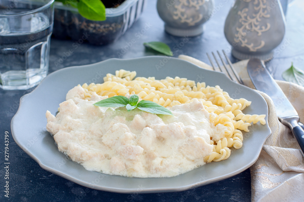 Fricassee, chicken meat in a creamy sauce, with pasta, horizontal Fricassee, chicken meat in a creamy sauce, with pasta, horizontal