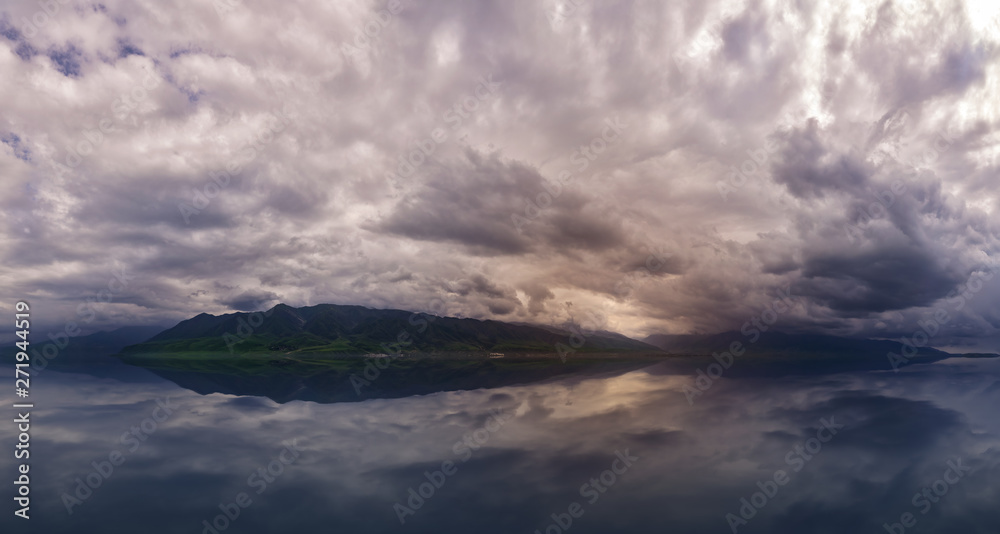 Amazing cloud over the mountains. dramatic storm over the lake and mountains. Adventure for hiking, climbing and other outdoor sports Amazing cloud over the mountains. dramatic storm over the lake and mountains. Adventure for hiking, climbing and other outdoor sports