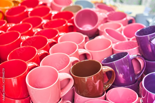 Many colorful empty ceramic cups in store, Mugs background