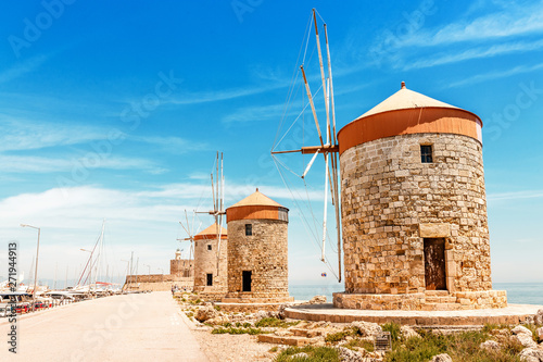Famous tourist destination - old Windmills in the Mandraki port of Rhodes, Greece