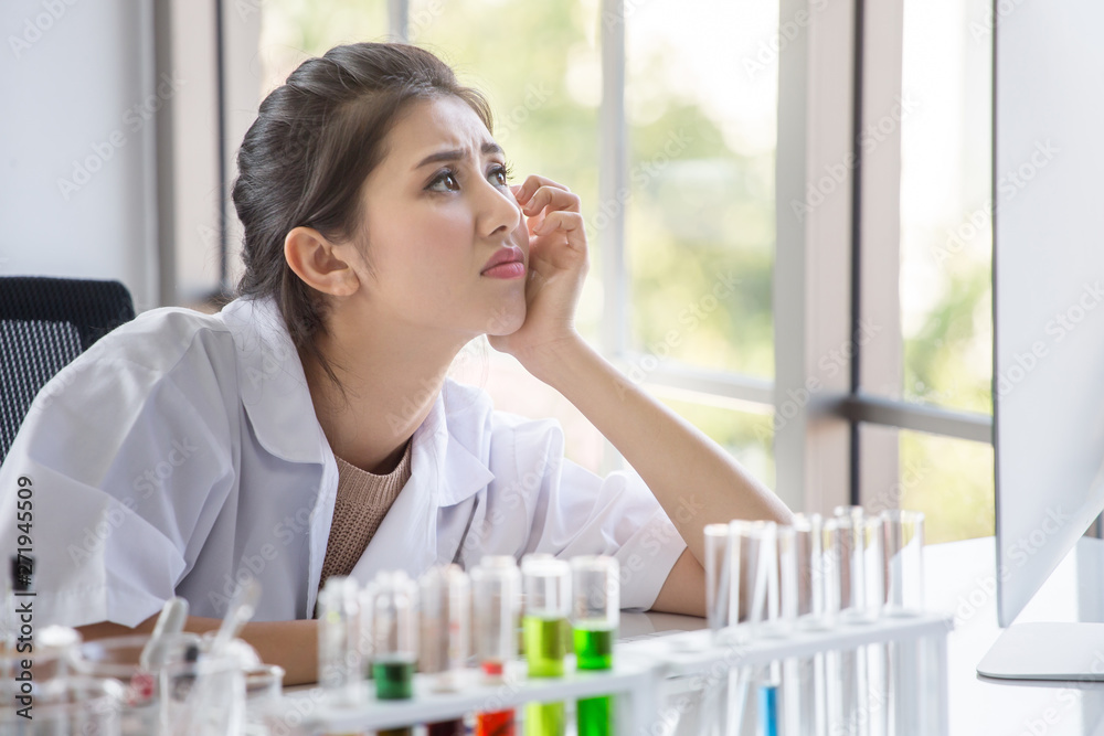 young asian woman research scientist preparing test tube and analyzing