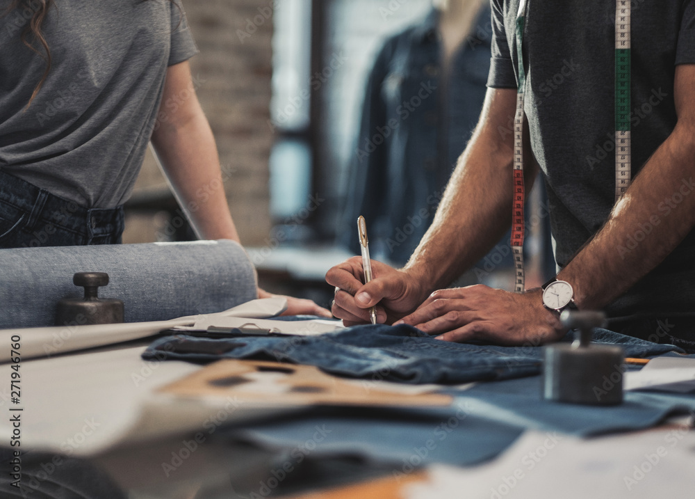Obraz premium Fashion designer working in his studio