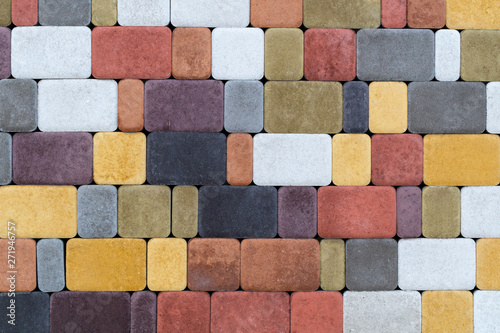The texture of the paving stones wall of different colors for construction. Facing building material.