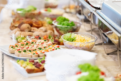 Catering served table with delicious food snacks.
