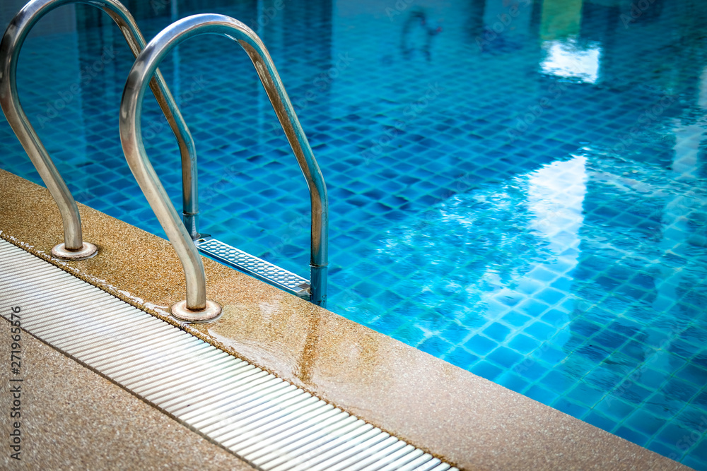 metal steel handle at edge poolside of swimming pool in hotel metal steel handle at edge poolside of swimming pool in hotel