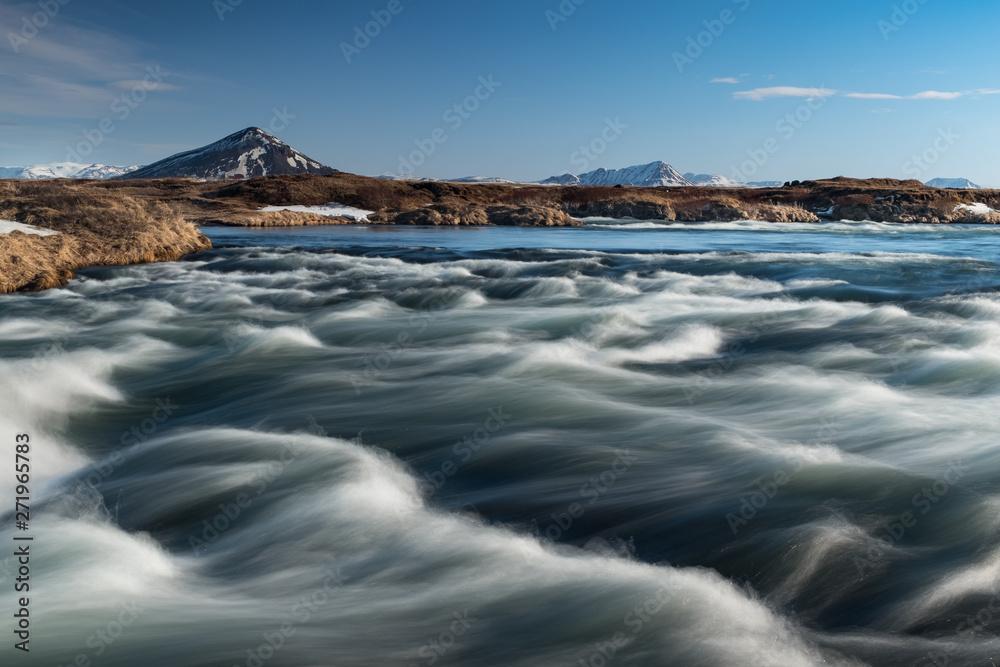 River waves with a mountain background River waves with a mountain background