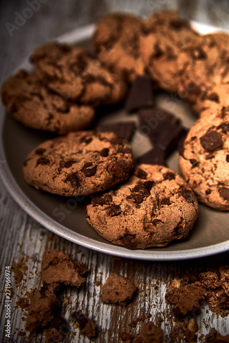 group of tasty cookies next to a bowl