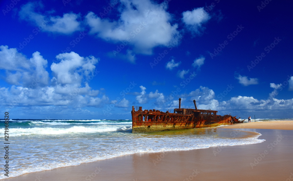 The rusty wreck of the vessel Maheno on the shores of Fraser Island (Queensland, Australia). The antique rusty and damaged boat and corrosion in the ocean sea. The rusty wreck of the vessel Maheno on the shores of Fraser Island (Queensland, Australia). The antique rusty and damaged boat and corrosion in the ocean sea.
