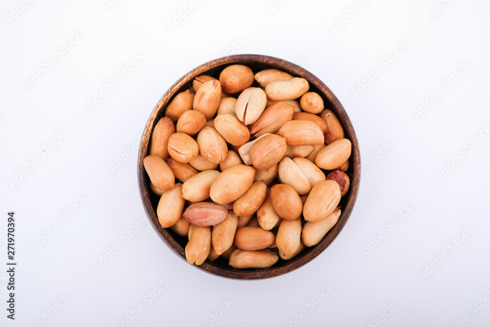 Roasted peanuts are in bowl, top view photo of peanut Roasted peanuts are in bowl, top view photo of peanut