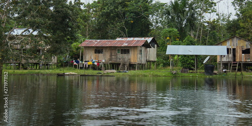 Houses in the village Santa Clara near Puerto Narino at Amazonas river in Colombia © kstipek