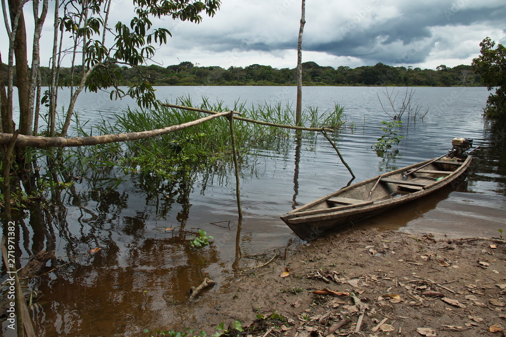Fototapeta premium Wooden boat at the village Santa Clara near Puerto Narino at Amazonas river in Colombia