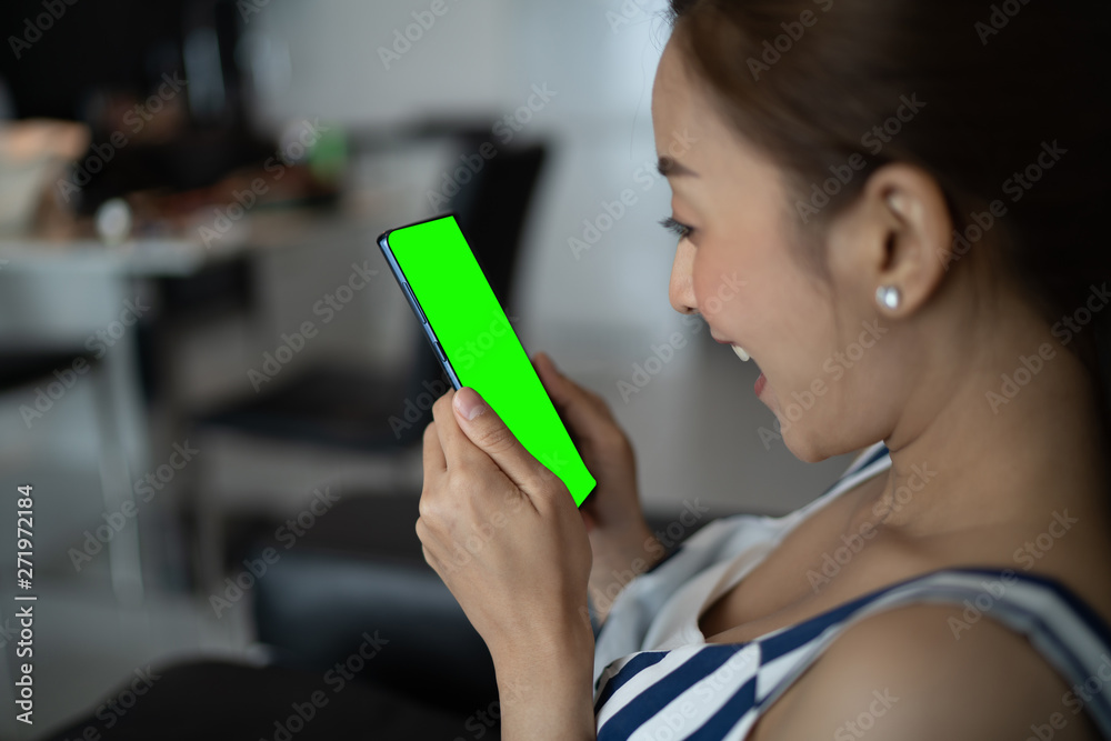 girl asian in happy emotional by use smartphone in room her by relaxing on vacation with sit on sofa girl asian in happy emotional by use smartphone in room her by relaxing on vacation with sit on sofa